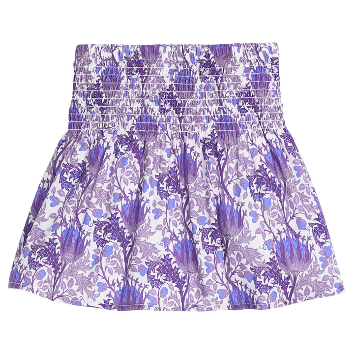 Girls/tween woven skort in a blue/purple/white floral print that features a ruched/elastic waistband and built in shorts for a secure but relaxed fit. 