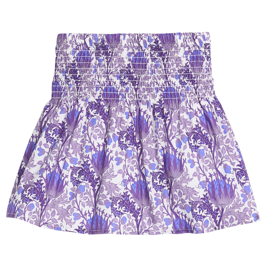 Girls/tween woven skort in a blue/purple/white floral print that features a ruched/elastic waistband and built in shorts for a secure but relaxed fit. 