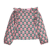 Girls/tween woven long sleeve top in pink/green floral that features ruffle detail along body/sleeves, elastic cuffs at sleeve ends, and button closures along back. 