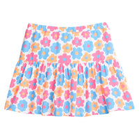 Girl/tween knit skort, with built in shorts, elastic waistband, and slight ruching along bottom. Skort is a colorful floral print with orange, pink, and blue flowers printed across it.