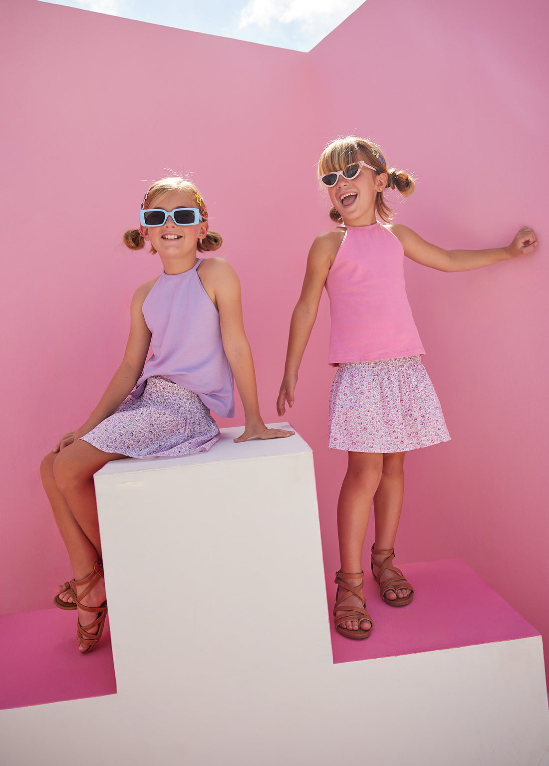 Girl/tween halter top in our Pink color which has button enclosures on the back for a secure fit. We have it paired here with our shirred circle skirt in our new Pink Daisy floral pattern