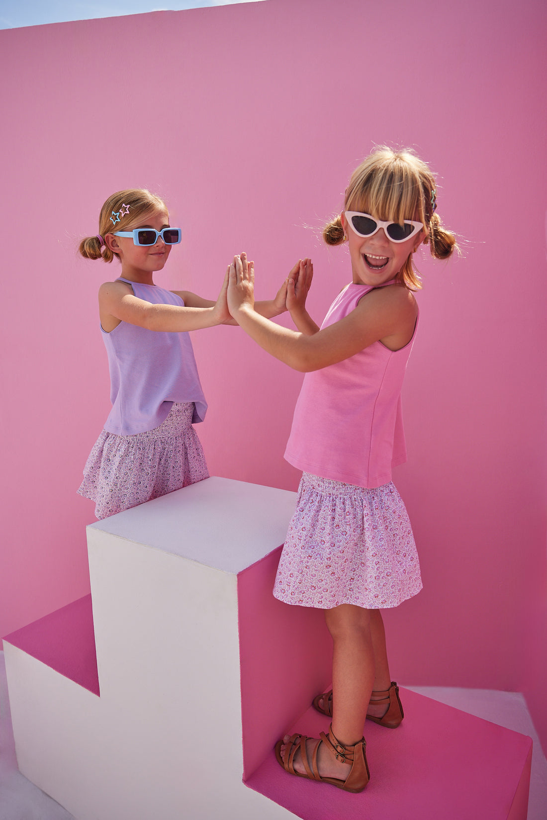 BISBY girls rocking our new Shirred Circle Skirts in our Pink and Purple Daisy patterns. The skirts have ruching along the waist for a stretchy comfortable feel and pair perfectly back with our Halter Tops in Lavender or Pink.