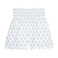 BISBY girl woven white shorts with a blue and green floral print. Shorts feature a smocked waistband, pockets, and a ruffled bottom hem for an elevated look. 