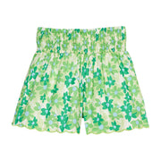 BISBY girl woven shorts with a blue and green floral print. Shorts feature a smocked waistband, pockets, and a scalloped bottom hem for an elevated look. 