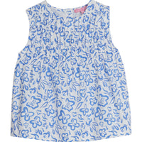 Girls/Tween sleeveless woven top in a blue and white floral print. Top features ruching at the bust and fans out for a relaxed comfy fit. 