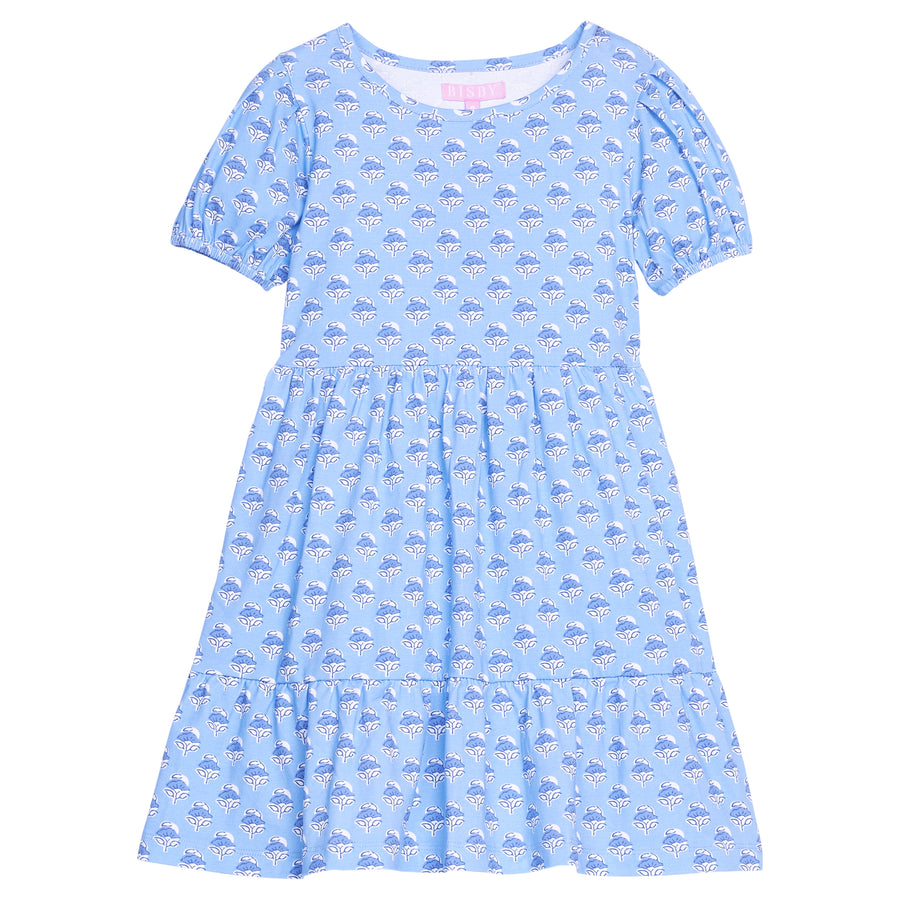 Girls/tween blue floral knit short sleeve dress that features elastic cuffs at sleeves and tier details to elevate the look. 