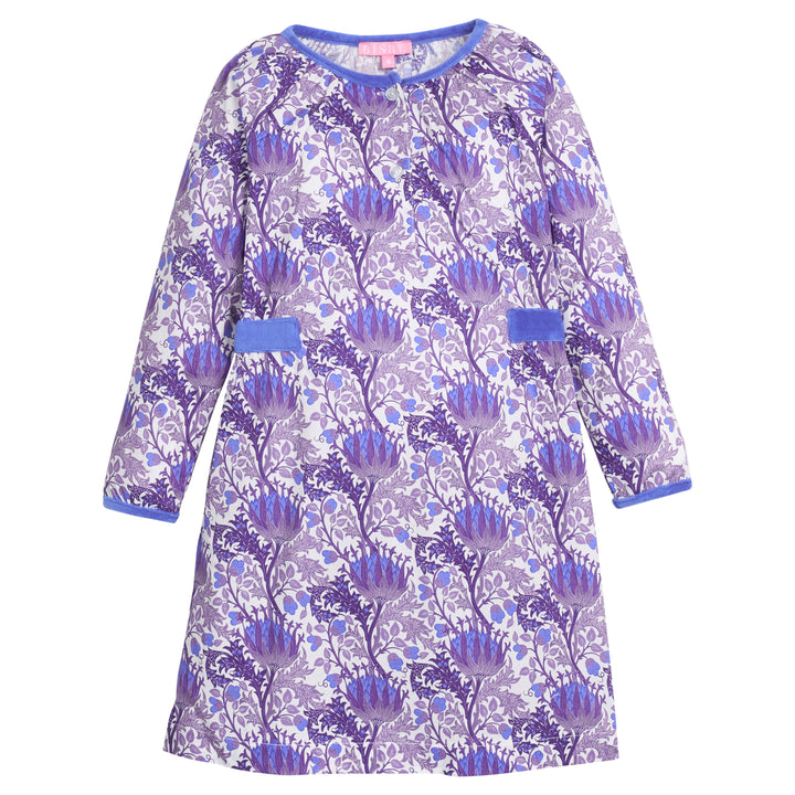 Girls/tween woven dress in blue/purple/white floral that features button closure at front neckline and blue velour detail along outside trim of dress for an elevated look. 