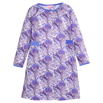 Girls/tween woven dress in blue/purple/white floral that features button closure at front neckline and blue velour detail along outside trim of dress for an elevated look. 