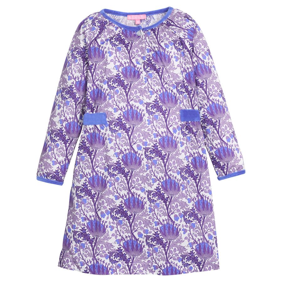 Girls/tween woven dress in blue/purple/white floral that features button closure at front neckline and blue velour detail along outside trim of dress for an elevated look. 