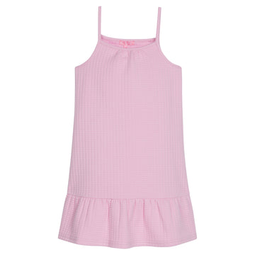 Girl/tween dress with thin stretchy straps and a waffle knit pattern, all in a solid light pink color. 