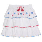 tween girls tiered mini skirt with blue and pink embroidery and pink and blue pom pom trim