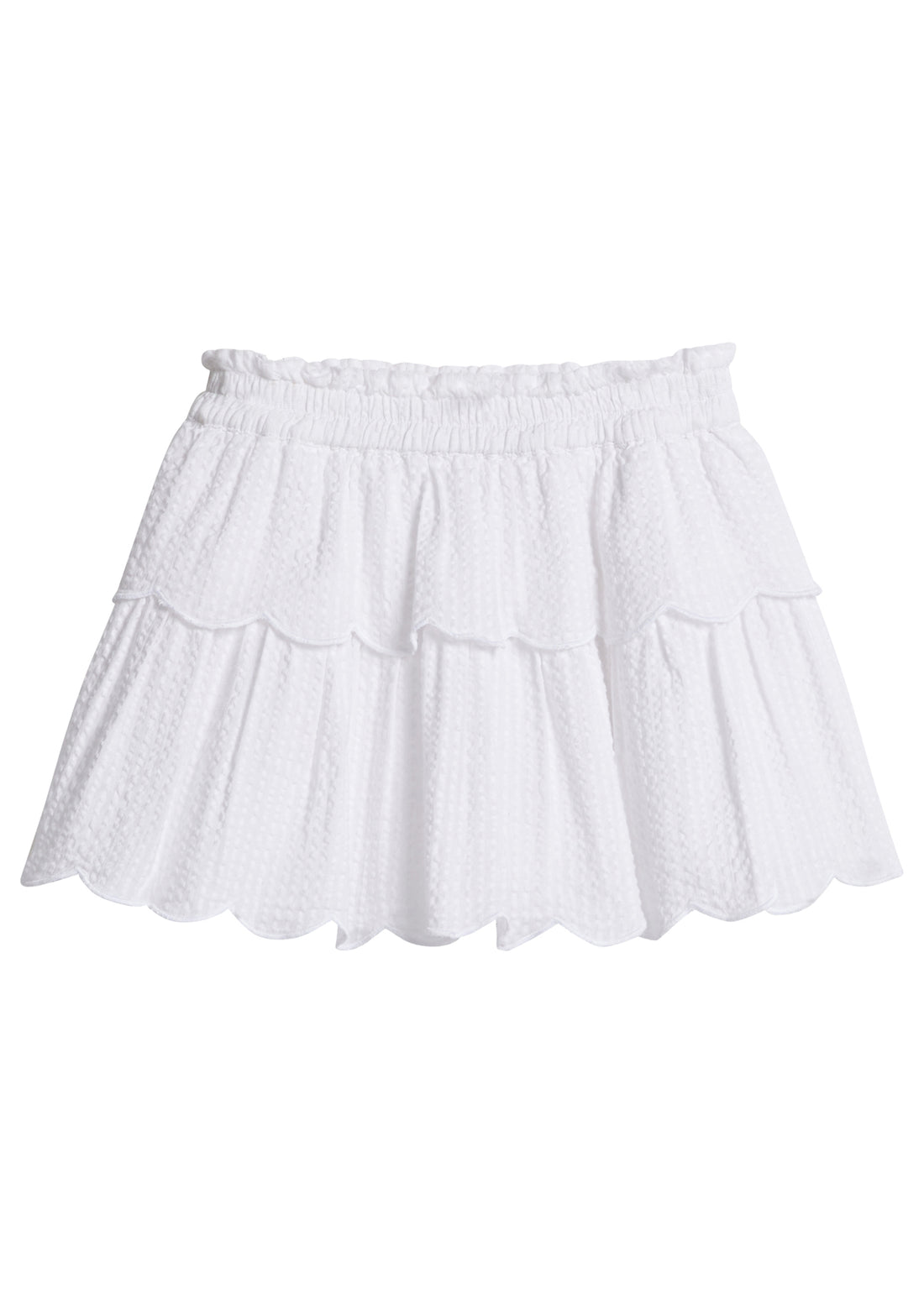 Girls/Tween woven white seersucker two tiered skort. Skort features an elastic waistband and has built in shorts underneath for a relaxed but secure fit.