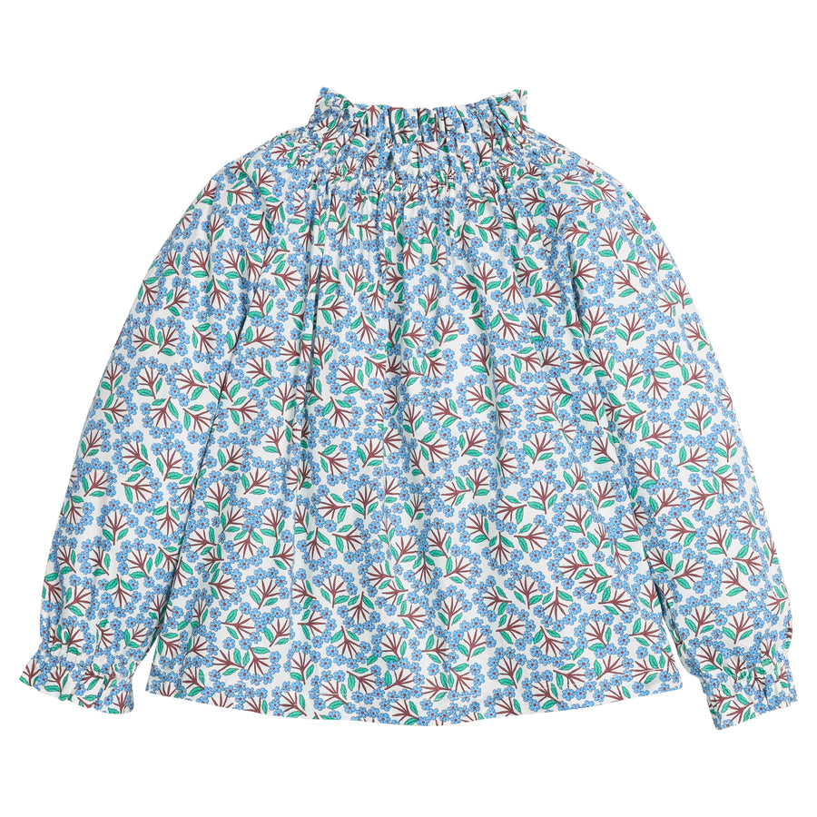 Girls/tween woven top in blue/green/brown floral print that features an elastic high neck collar and elastic cuffs at sleeves for a secure but relaxed fit. 