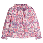 Girls/tween woven top in pink/purple floral print that features an elastic high neck collar and elastic cuffs at sleeves for a secure but relaxed fit. 