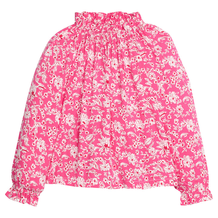 Girls/tween rayon top in pink/red/white floral print that features an elastic high neck collar and elastic cuffs at sleeves for a secure but relaxed fit. 