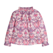 Girls/tween woven top in pink/purple floral print that features an elastic high neck collar and elastic cuffs at sleeves for a secure but relaxed fit.