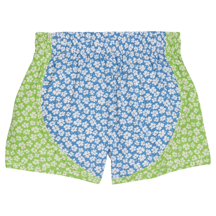 Girl/tween athletic short with elastic waistband that have blue and white floral pattern in the middle of shorts and light green and white floral pattern along outside of shorts.