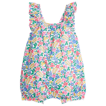 Baby girl bubble with adjustable ruffle straps and elastic along leg openings. Has a colorful floral pattern on top of white background.