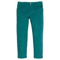 Girls/tween green velvet pants that feature functional pockets and a snap button closure. 