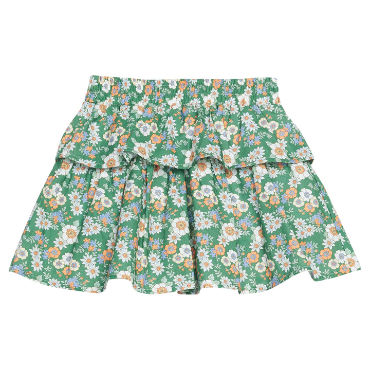 Girls woven skort featuring a green background with white, orange, and blue florals. 