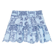 BISBY girl woven two tiered skort in a light blue and navy blue bandana print. Skort features built in shorts, elastic waistband, and light blue embroidery at scallop edge to elevate the look. 