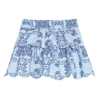 BISBY girl woven two tiered skort in a light blue and navy blue bandana print. Skort features built in shorts, elastic waistband, and light blue embroidery at scallop edge to elevate the look. 