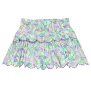 BISBY girl woven two tiered skort in a blue/purple/green floral print. Skort features built in shorts, elastic waistband, and purple embroidered scallop edge to complete and elevate the look. 