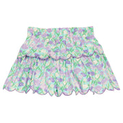 BISBY girl woven two tiered skort in a blue/purple/green floral print. Skort features built in shorts, elastic waistband, and purple embroidered scallop edge to complete and elevate the look. 