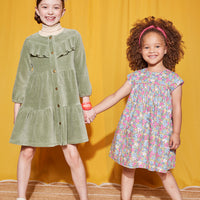 Little Girls seen wearing our Charlotte Dress in Merion Floral (right and our Western Dress in sage Green (on left)--BISBY girls