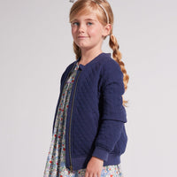 Navy blue quilted sweatshirt bomber jacket with blue and lilac floral dress for girls and toddlers