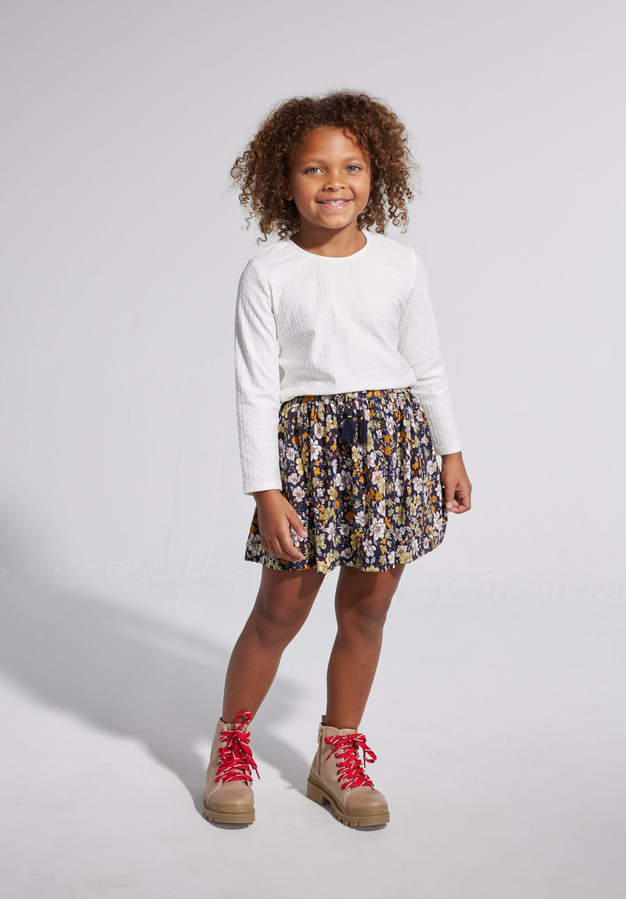 cotton white long sleeve shirt with a navy floral skirt with tassel ties for girls 