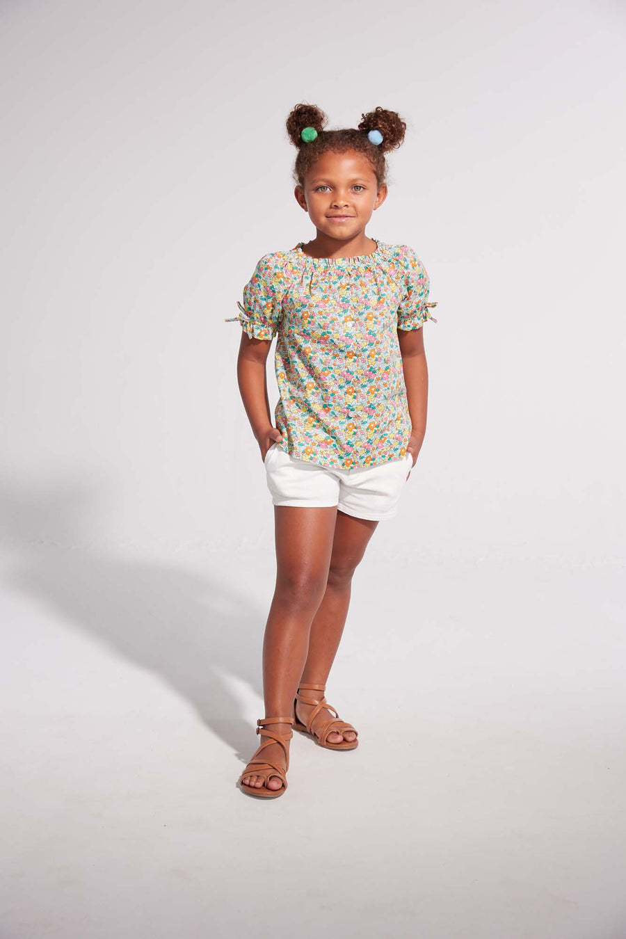 tween girls short sleeved button up top in green and pink floral pattern