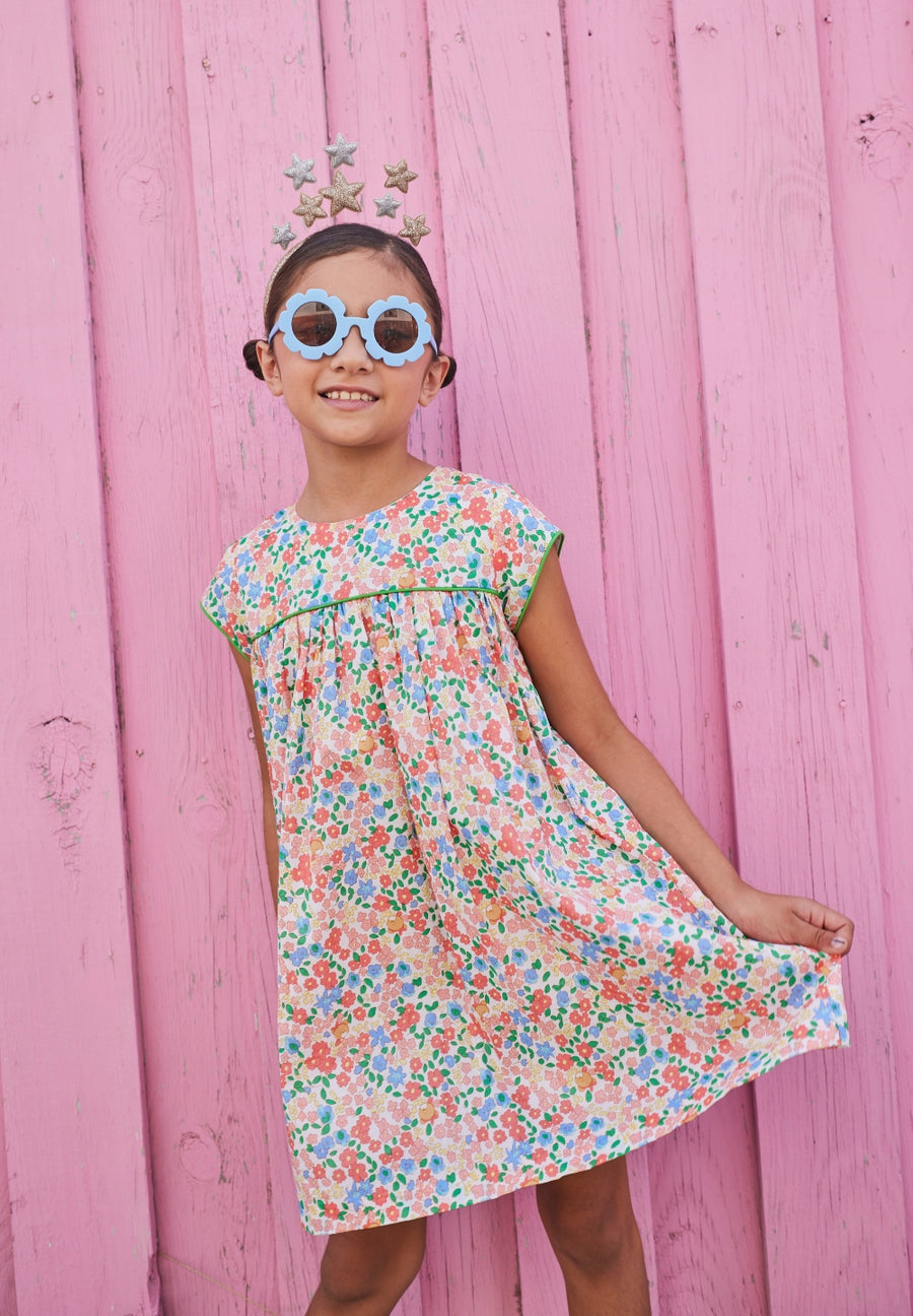 tween girls short sleeve dress with colorful floral print and green piping on the chest