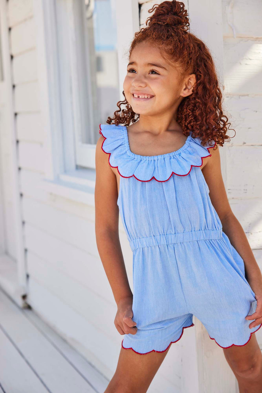 tween girls chambray romper with scalloped neckline and hem and red trim