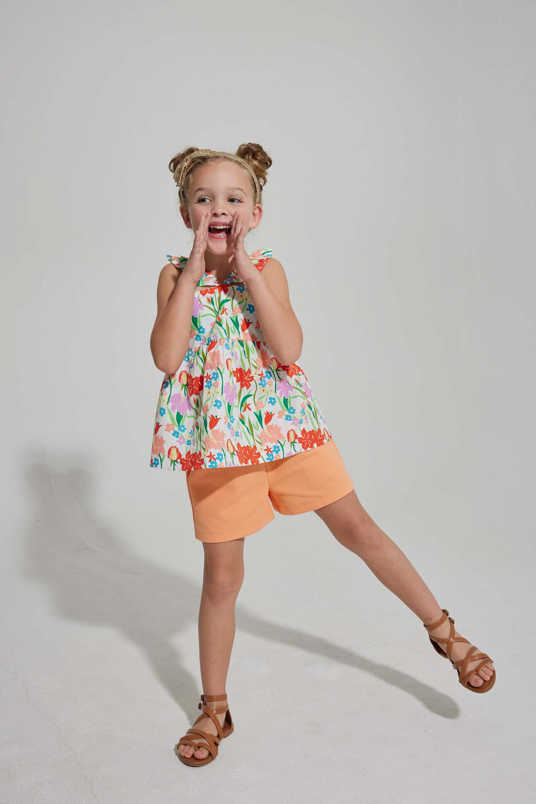 tween girls bright orange shorts with elastic waistband and pockets