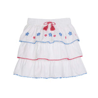 tween girls tiered mini skirt with blue and pink embroidery and pink and blue pom pom trim