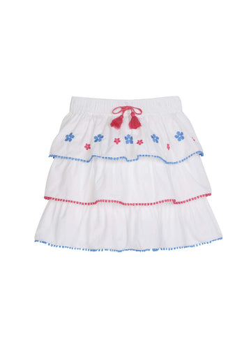 tween girls tiered mini skirt with blue and pink embroidery and pink and blue pom pom trim