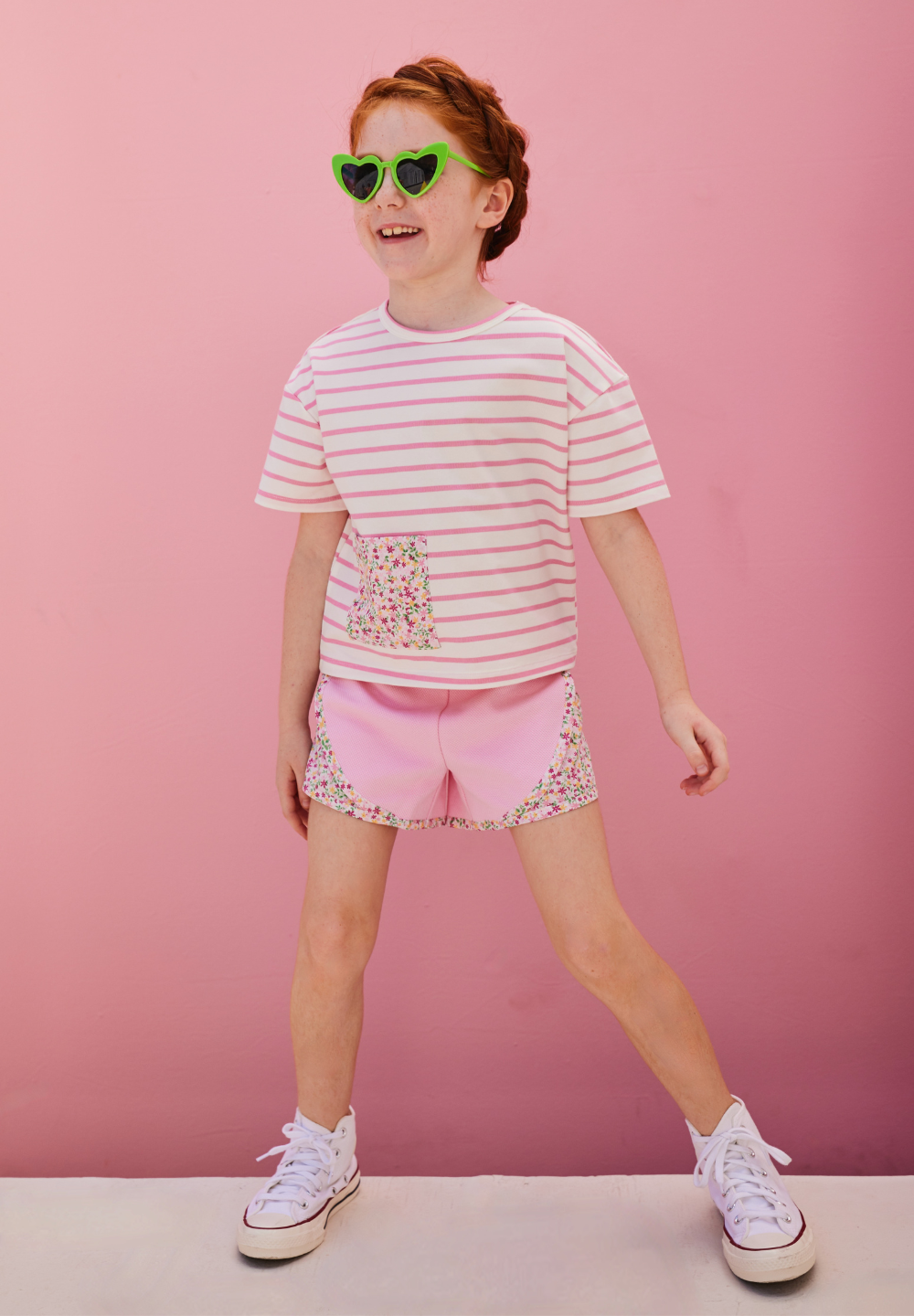 tween girls pink track shorts with floral detail on the sides