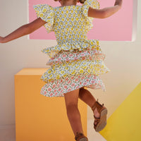 tween girls cinched top with flutter sleeves and peplum hem in yellow floral pattern