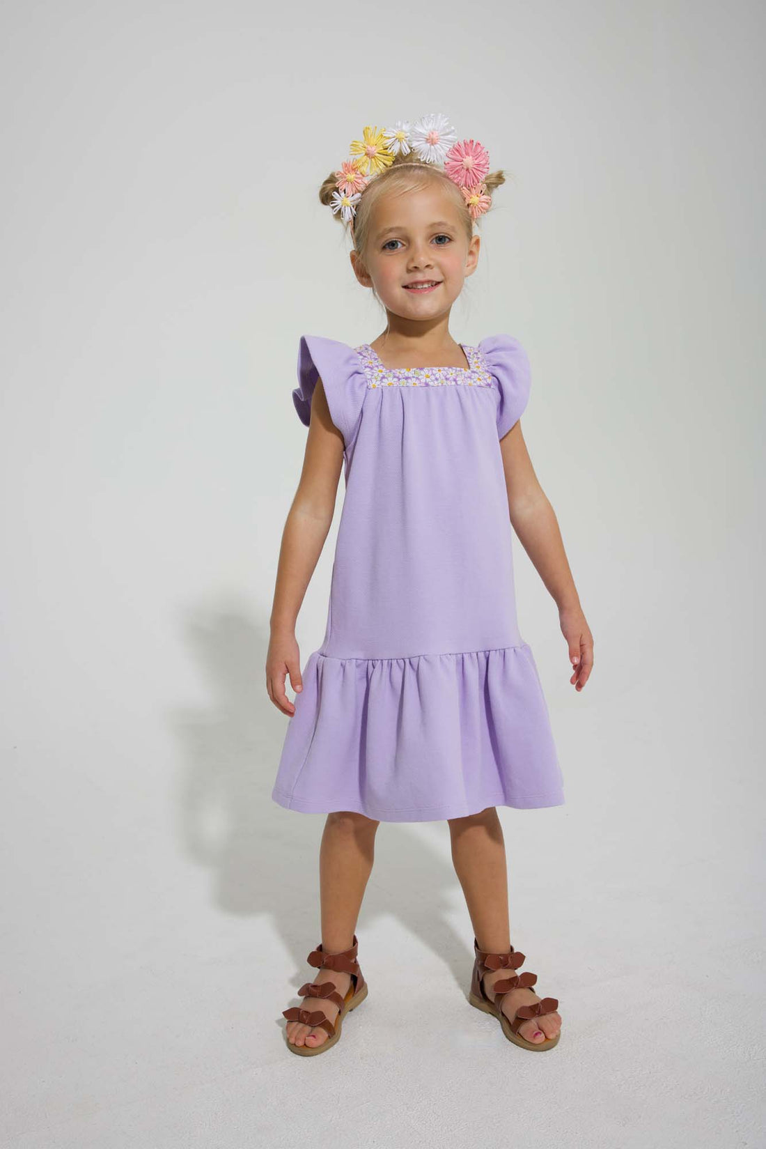 tween girls drop hem dress with floral trim around the neck