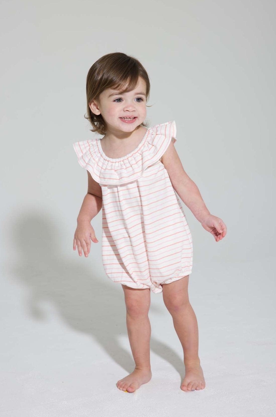 baby girl pink and orange striped bubble with ruffled neckline