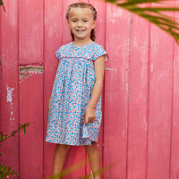tween girls blue and red floral dress with red piping across the chest and on the sleeves