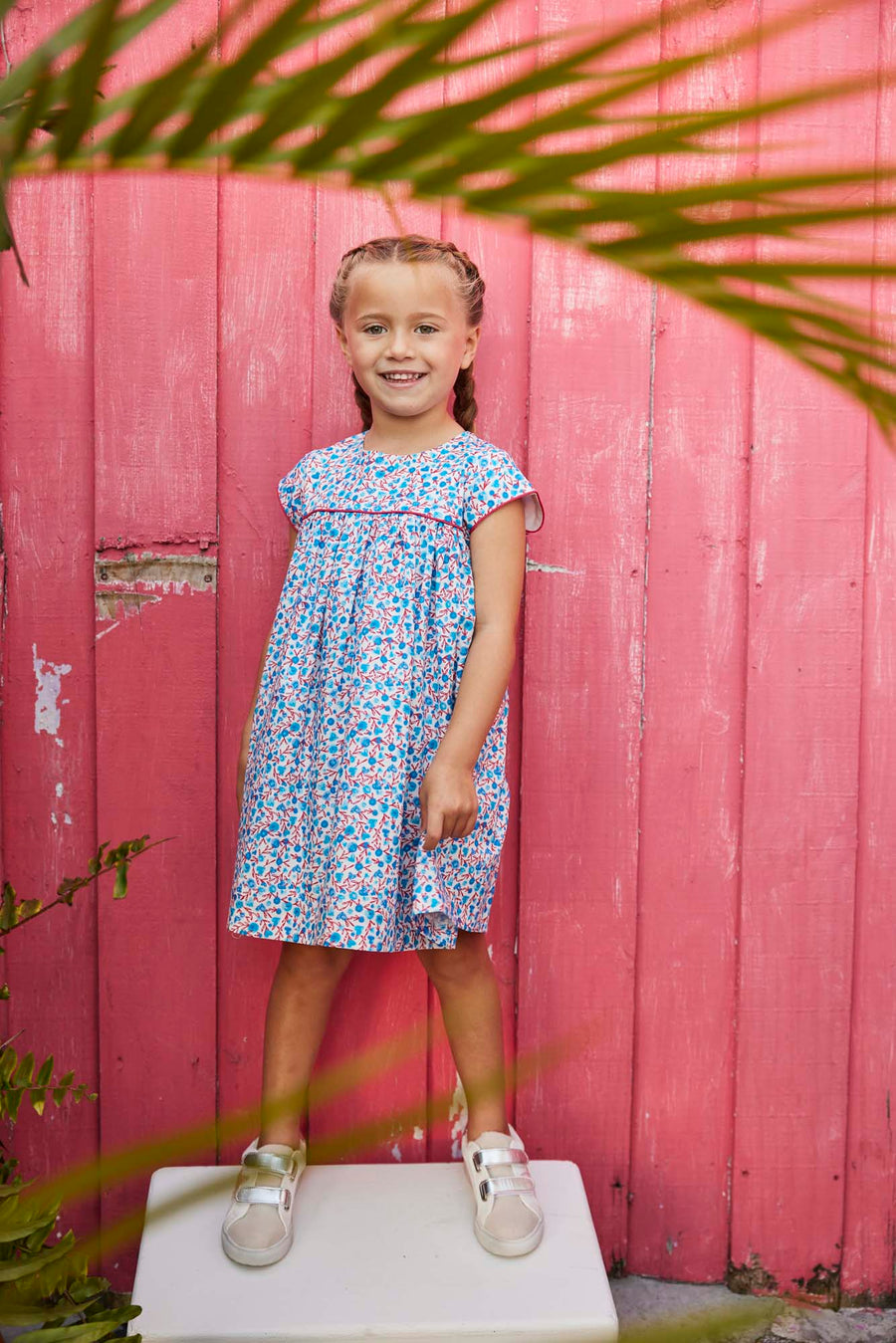 tween girls blue and red floral dress with red piping across the chest and on the sleeves