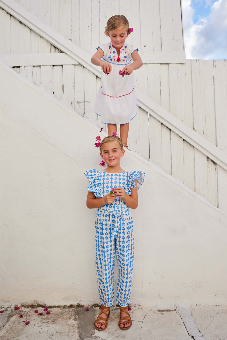 tween girls blue and white ruffled jumpsuit with open back and front tie 