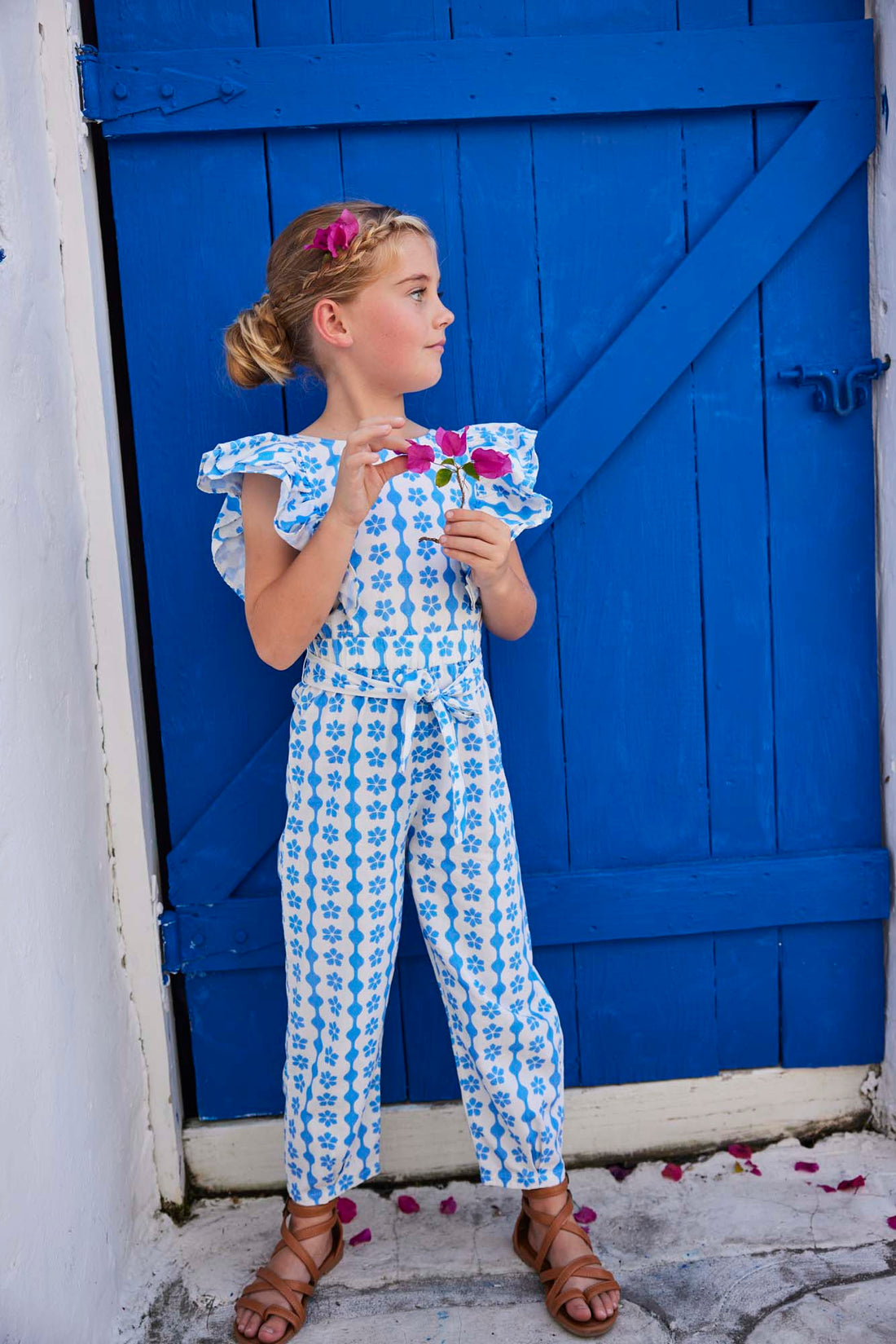 tween girls blue and white ruffled jumpsuit with open back and front tie 