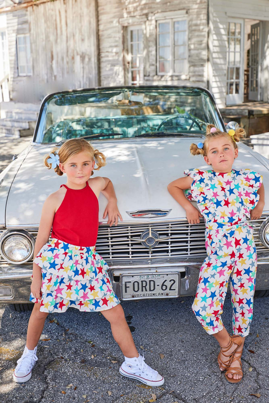 tween girls jumpsuit in multi-colored star pattern with ruffles and front tie 