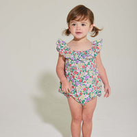 baby girl romper with scalloped neckline in purple floral pattern