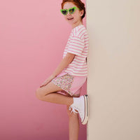 tween girls pink track shorts with floral detail on the sides